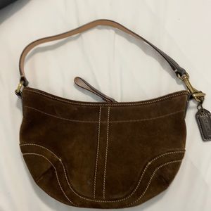 Brown, suede Coach purse.